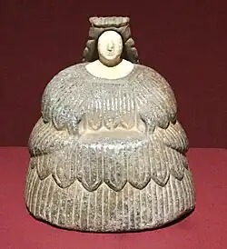 Female figurine of the "Bactrian princess" type; between 3rd millennium and 2nd millennium BC; grey chlorite (dress and headdresses) and calcite (face); Barbier-Mueller Museum (Geneva, Switzerland)