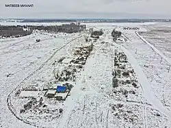 An overhead picture of Yangi-Kyuch covered in snow.