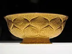 Tang era gilt-gold bowl with lotus and animal motifs