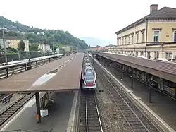Station building and platforms from the footbridge, looking south
