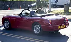 Rear view of the MG RV8, unusual in Flame Red