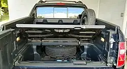2009 Ridgeline RTL with full-size spare in spare tire service tray and temporary tire mounted on OEM bed wall mount