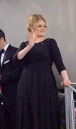 Adele in a black dress.