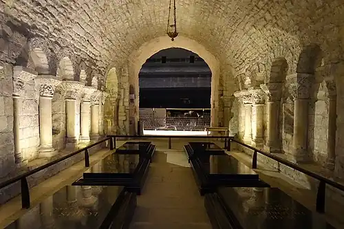 The archeological crypt (8th century) rebuilt by Suger (12th c.), now contains the simple black marble tombs of Louis XVI and Marie Antoinette