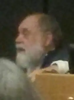 A blurry headshot of Cash, gazing towards the left