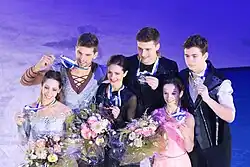 The pairs event medalists at the 2018 Grand Prix of Helsinki