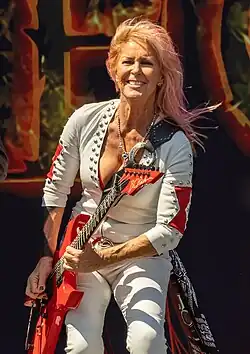 Lita Ford playing a guitar onstage