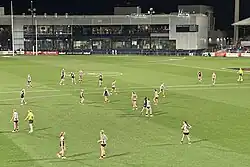 Players settle into position on the field