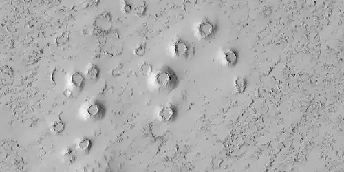 Close view of cones, as seen by HiRISE under HiWish program. These cones probably formed when hot lava flowed over ice-rich ground.