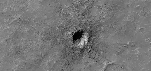 Small crater, as seen by HiRISE under HiWish program. Much of the ejecta consists of boulders.