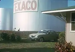 Photo of car with oil tank in the back.