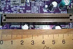 An AGP port, with ruler for scale