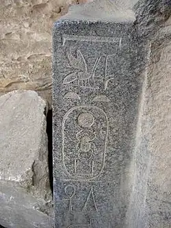 Frosted hieroglyphs and cartouche shown on medium-gray and white stone, Egypt of Pharaoh Senusret I