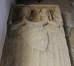 Effigial slab for Sir William de Bayous (d. c. 1327) and his wife. Church of St Stephen, Careby, Lincolnshire, England.[85]