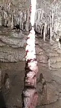 A stalagmite and stalactite almost touch