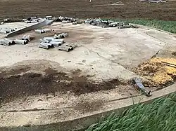 A round cement slab and bits of metal