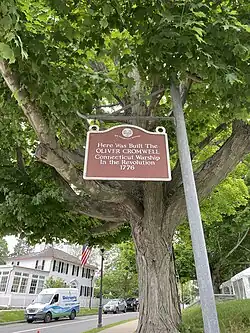 A sign on Main Street in Essex, Connecticut marks the spot where the Oliver Cromwell was constructed.