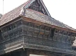 Traditional ornate gable (mukhappu) and window benches (charupadi)