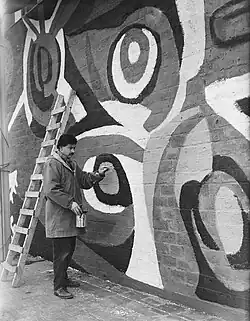 'Karel Appel, making a wall-painting in Rotterdam', 1955