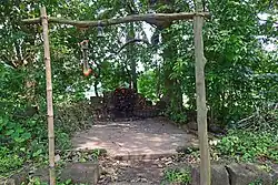 Atbaichandi idol in what remains of a temple