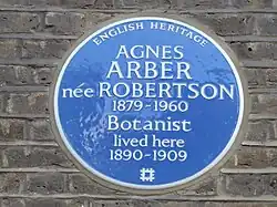 blue circular plaque reading "Agnes Arber née Robertson 1879-1960 lived here 1890-1909." At the top it reads "English Heritage"