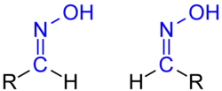 Isomerie der Aldoxime: links ein früher als syn-, heute als (E)-konfiguriert zu beschreibendes Aldoxim, rechts das entsprechende (Z)- (veraltet: anti)-Isomer.