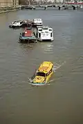 Amphibious tour bus – a converted DUKW – on Thames river in London near Lambeth Bridge.