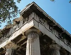 The entablature of the Hephaisteion in Athens, showing Doric frieze with triglyphs and sculpted metopes.