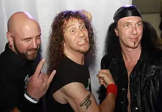 Anvil in 2010. L–R: Former bassist Glenn Five, Steve "Lips" Kudlow, Robb Reiner