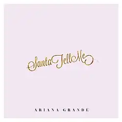 A pink square with the song's title in cursive writing