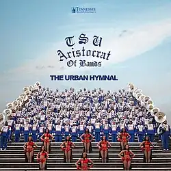 The band and several cheerleaders lined up on bleachers