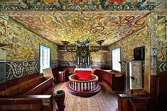 Altar, crucifix, baptismal font