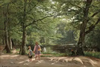 View from a forest with two children walking on a path.