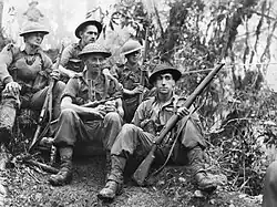 Soldiers rest in the jungle