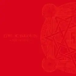 A red album cover, with the words "LIVE AT BUDOKAN" and "~RED NIGHT~" on the left side and one half of a circular design on the right side, both in a lighter red color.