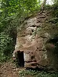 Sandstone outcrop with small caves, near the eastern end of the Upper Pool.