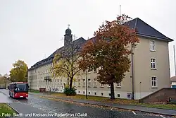 A photograph of the HQ building in Barker Barracks Paderborn c2016. To the right of the building is the memorial wall of 35 Engineer Regiment.[5]