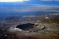 Image 23Meteor Crater in Arizona. Created 50,000 years ago by an impactor about 50 metres (160 ft) across, it shows that the accretion of the Solar System is not over. (from Formation and evolution of the Solar System)