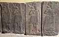 Basalt wall slab showing Assyrian soldiers in procession, holding maces and bows. From the palace of Tiglath-pileser III at Hadatu, Syria. Ancient Orient Museum, Istanbul