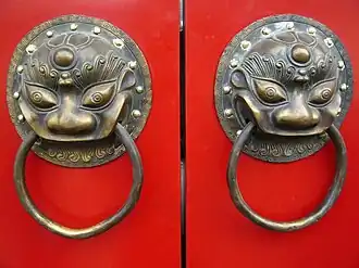 Image 25A traditional red Chinese door with Imperial guardian lion knocker (from Chinese culture)