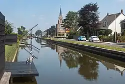 Canal along the Noordeindeseweg with church (Onze Lieve Vrouw Geboortekerk) in the background