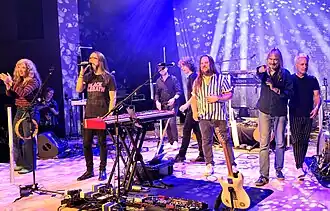 Big Big Train in 2024. Left to right: Claire Lindley, Alberto Bravin, Paul Mitchell, Oskar Holldorff, Rikard Sjöblom, Gregory Spawton and Nick D'Virgilio.