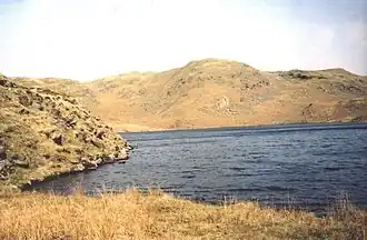 A deep blue lake surrounded by steep sides