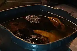 Hot stones in a vat of hot resin