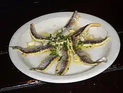 Boquerones en vinagre, marinated white anchovies, a classic tapa.