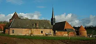 The chateau and church bell tower in Bouelles