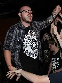 Calzini performing with We Are Defiance in 2012.