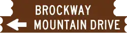 A graphic representation of the brown wooden sign for Brockway Mountain Drive