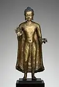 Buddha offering protection; late 6th–early 7th century; copper alloy; height: 47 cm, width: 15.6 cm, diameter: 14.3 cm; from India (probably Bihar / Later Gupta dynasty); Metropolitan Museum of Art