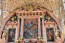 The upper region of the altar, with the central canvas of the Assumption